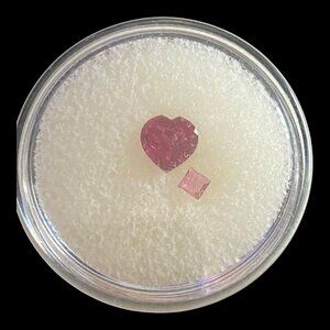 Heart-Shaped & Diamond-Cut Pink Tourmaline Gemstones In Display Case